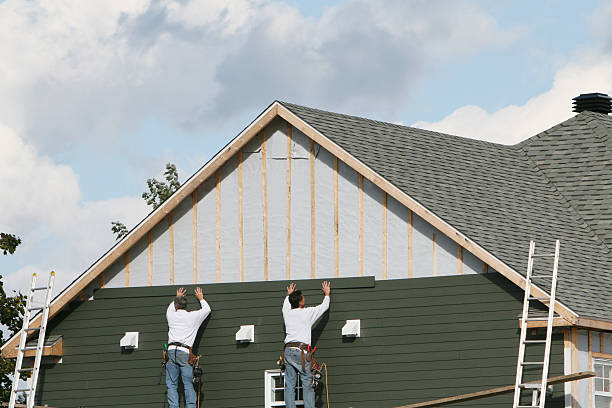 Professional Vinyl Siding technician working in Dover, MA